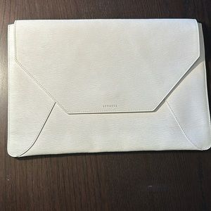 Senreve white vegan leather clutch.